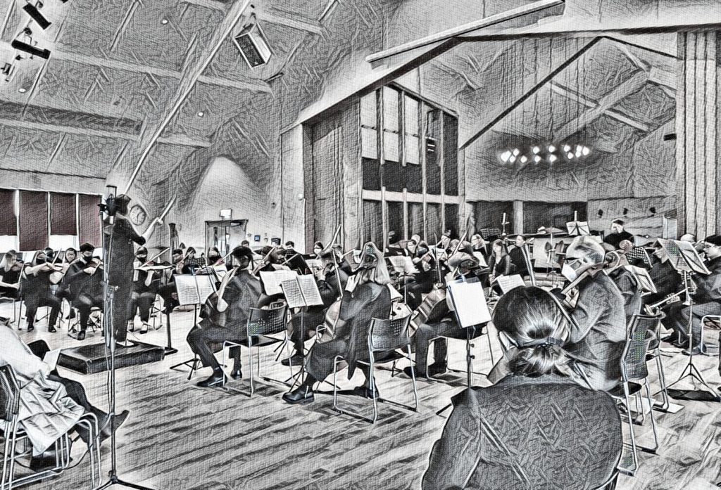 Black and white image of an orchestra playing in a concert